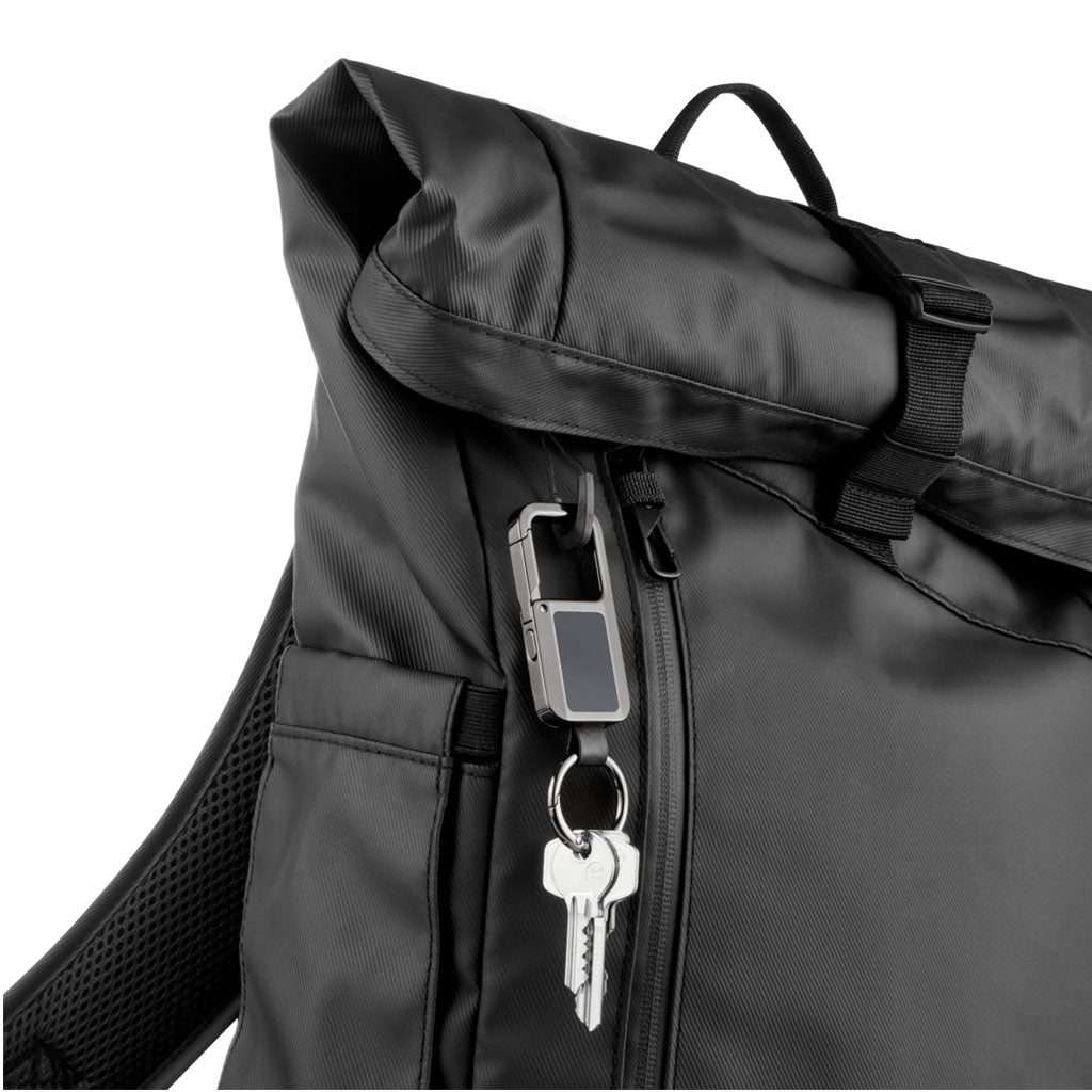 Troika TRACK & FIND CARABINER" - gunmetal, with "Apple Find My" - on a black backpack