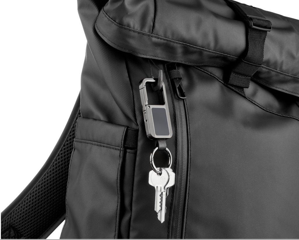 Troika TRACK & FIND CARABINER" gunmetal -KR26-13/GM, with "Apple Find My" - on a black backpack