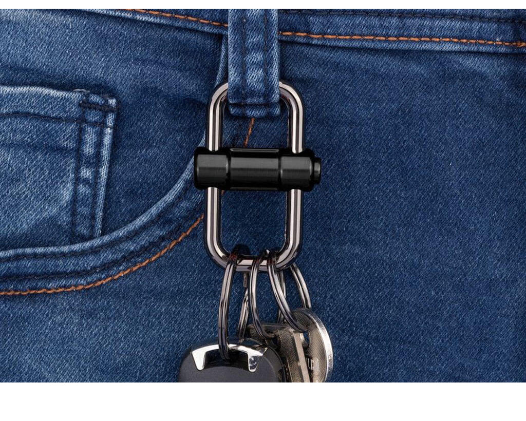 Troika Keychain on blue jeans