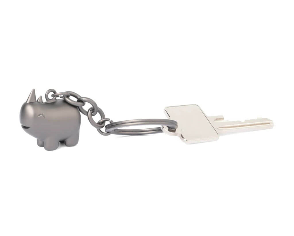 TROIKA HAPPY RHINO keyring featuring a cute rhinoceros design in matt gunmetal chrome-plated metal. A cheerful accessory and gift with personality.