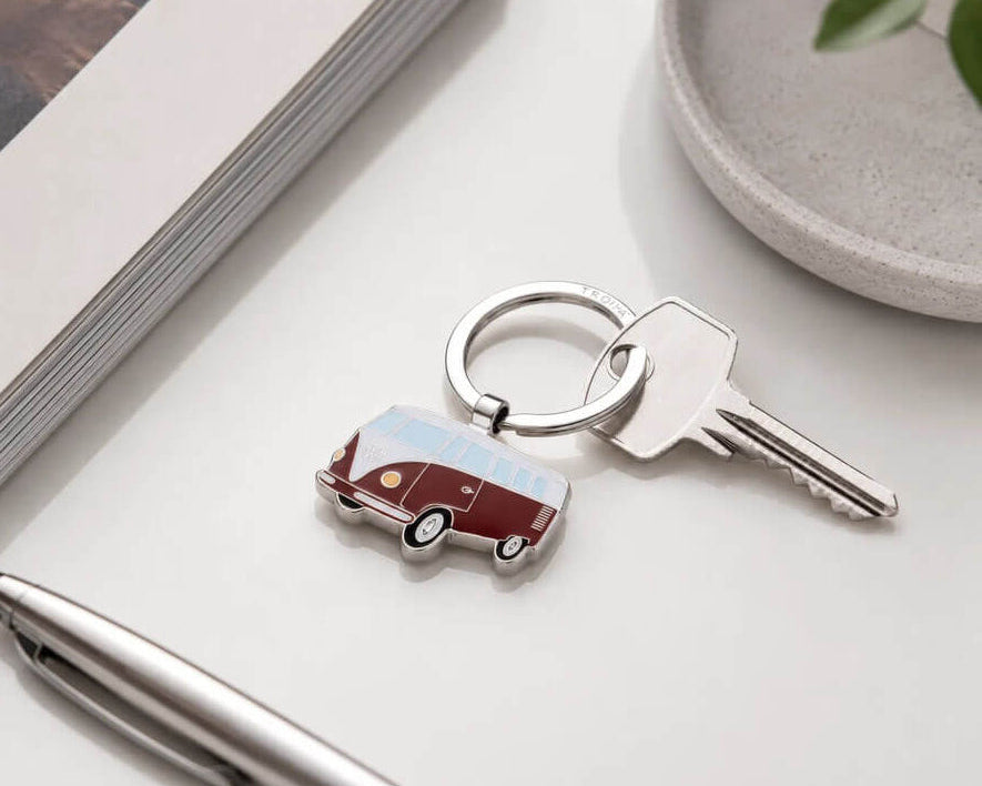 TROIKA VW BULLI T1 keyring in vibrant red, featuring the iconic Volkswagen van in shiny chrome-plated metal with enamel details. A perfect gift for VW fans.
